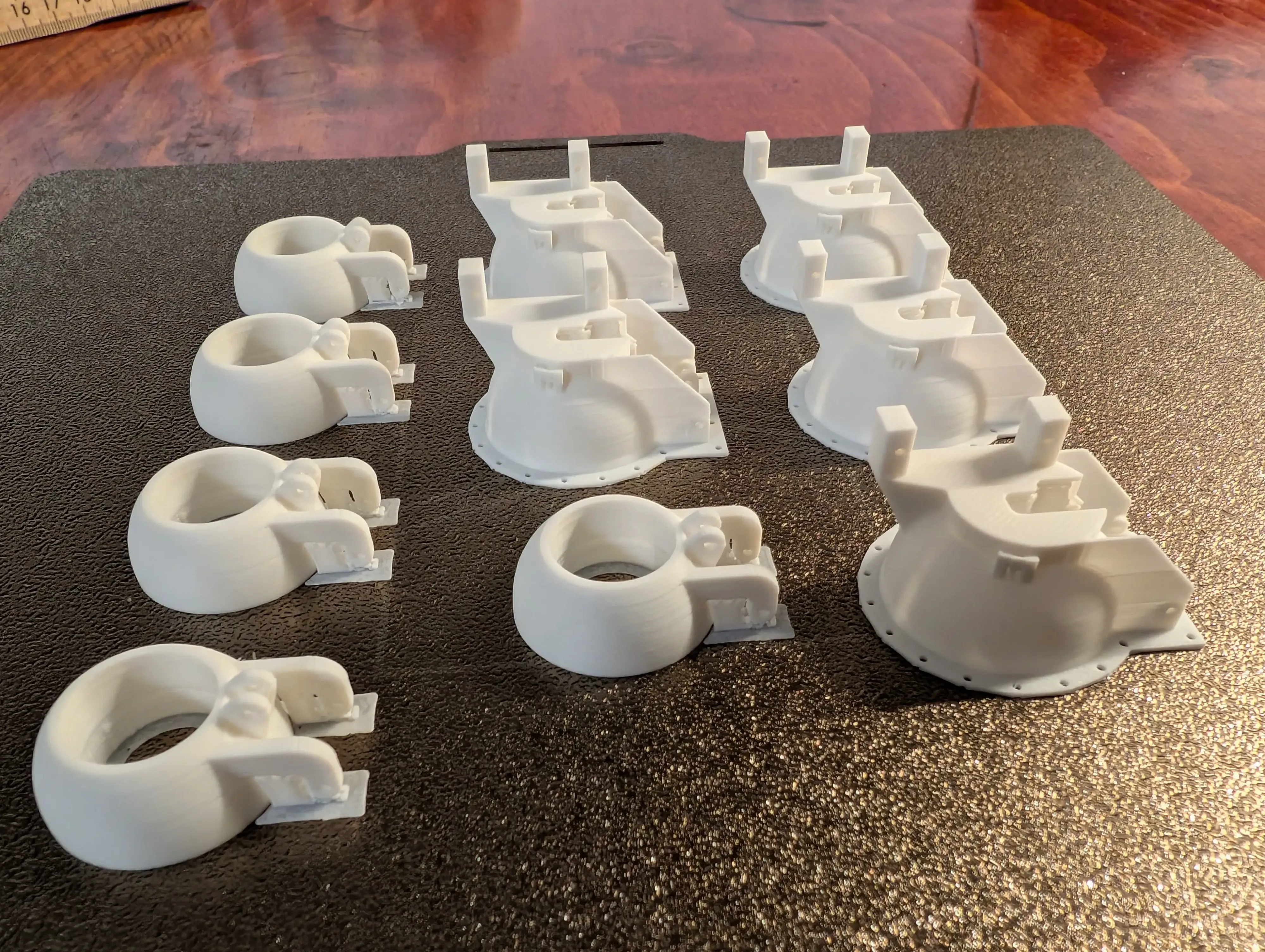 Scaled-down RC aircraft light assemblies ready for cleanup